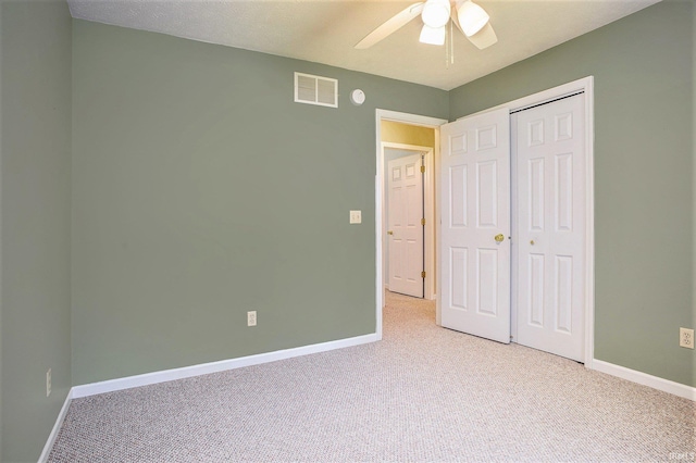 13920 Lexington Cir, Granger, IN 46530 - unfurnished bedroom featuring light carpet, a closet, and a ceiling fan