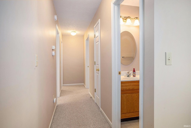 13920 Lexington Cir, Granger, IN 46530 - corridor with baseboards and light colored carpet