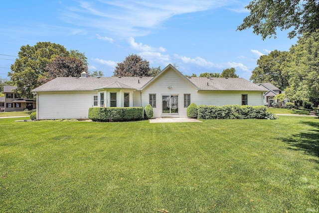 13920 Lexington Cir, Granger, IN 46530 - rear view of property featuring a yard, a patio, and a chimney