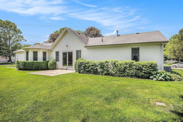 13920 Lexington Cir, Granger, IN 46530 - rear view of property featuring a patio, a yard, and roof with shingles