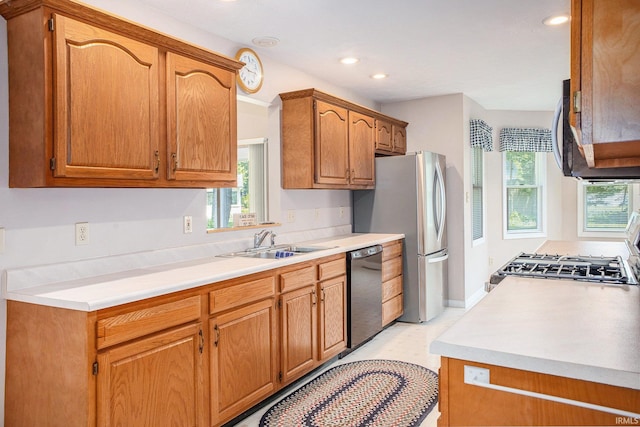 13920 Lexington Cir, Granger, IN 46530 - kitchen featuring black dishwasher, healthy amount of natural light, freestanding refrigerator, recessed lighting, and light countertops