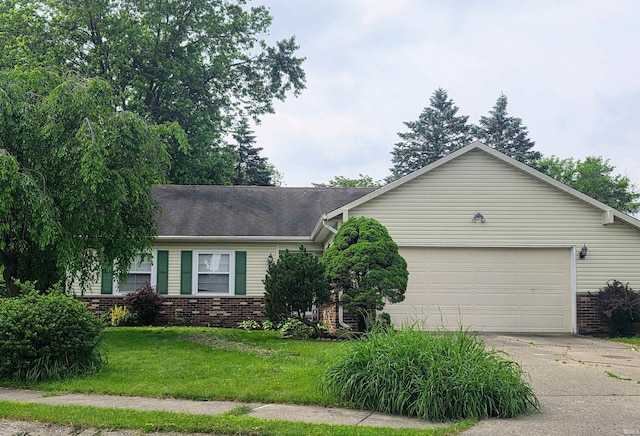 2914 Browning St, West Lafayette, IN 47906 - ranch-style house featuring brick siding, driveway, an attached garage, and a front yard