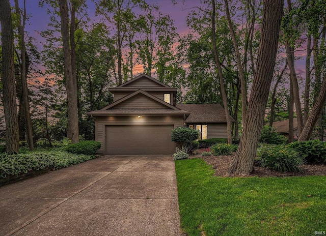 17991 Sable Ridge Dr, South Bend, IN 46635 - view of front of house featuring driveway, a chimney, and a front lawn