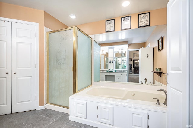 17991 Sable Ridge Dr, South Bend, IN 46635 - full bath with a stall shower, a bath, recessed lighting, vanity, and tile patterned flooring