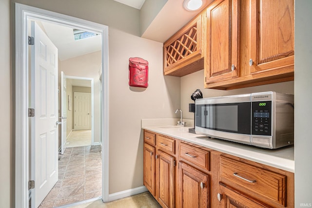 17991 Sable Ridge Dr, South Bend, IN 46635 - bar with stainless steel microwave and a sink