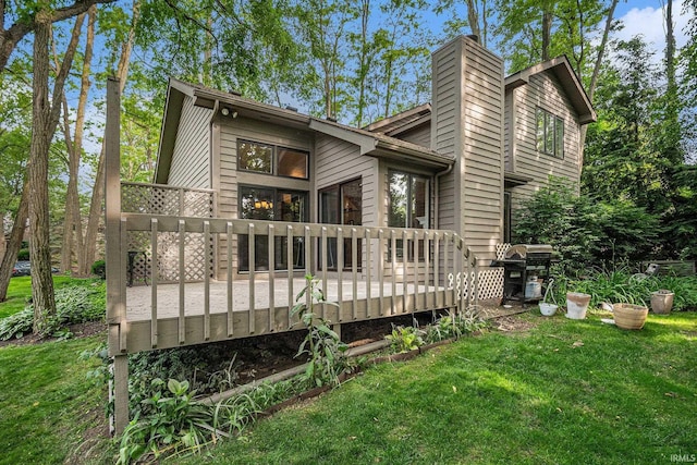17991 Sable Ridge Dr, South Bend, IN 46635 - rear view of house with a lawn, a chimney, and a deck