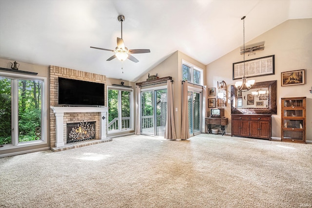 17991 Sable Ridge Dr, South Bend, IN 46635 - carpeted living area with plenty of natural light, a fireplace, a chandelier, ceiling fan, and high vaulted ceiling