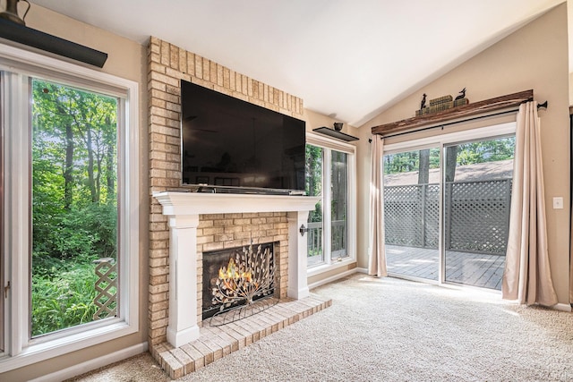 17991 Sable Ridge Dr, South Bend, IN 46635 - unfurnished living room with lofted ceiling, carpet floors, and a brick fireplace