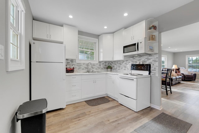 2405 E State Blvd, Fort Wayne, IN 46805 - kitchen with white appliances, white cabinetry, backsplash, light wood finished floors, and light countertops