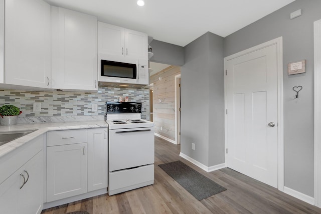 2405 E State Blvd, Fort Wayne, IN 46805 - kitchen with white appliances, white cabinetry, backsplash, and light wood-style flooring