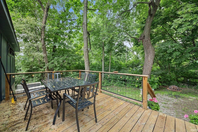 622 Romig St, Lafayette, IN 47901 - wooden deck featuring outdoor dining area and an outdoor fire pit
