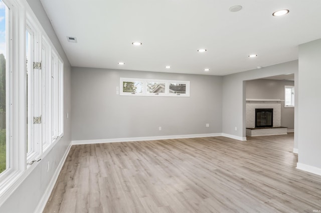 3524 Contessa Dr, Fort Wayne, IN 46816 - unfurnished living room featuring light wood-type flooring, recessed lighting, and a fireplace