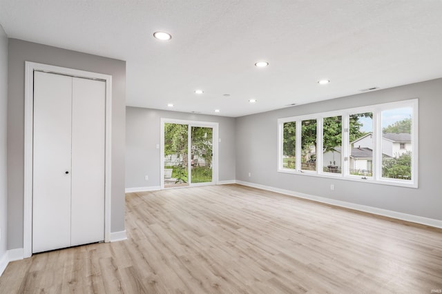 3524 Contessa Dr, Fort Wayne, IN 46816 - unfurnished living room featuring light wood-style flooring and recessed lighting