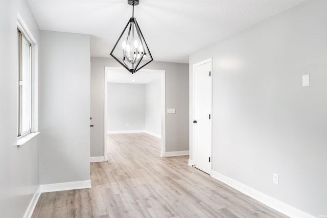 3524 Contessa Dr, Fort Wayne, IN 46816 - unfurnished dining area with a chandelier and light wood-type flooring