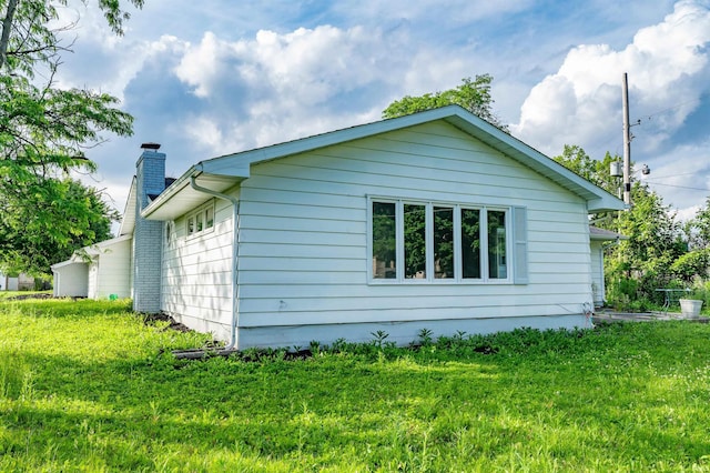 3524 Contessa Dr, Fort Wayne, IN 46816 - view of side of property featuring a chimney and a yard