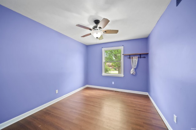 901 N Timberline Cir E, Warsaw, IN 46582 - unfurnished room featuring ceiling fan and wood finished floors