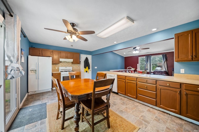 901 N Timberline Cir E, Warsaw, IN 46582 - dining room featuring ceiling fan and stone finish flooring