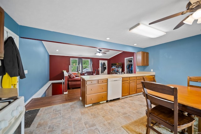 901 N Timberline Cir E, Warsaw, IN 46582 - kitchen featuring white appliances, a ceiling fan, a peninsula, light countertops, and open floor plan