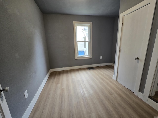 107 W S B St, Gas City, IN 46933 - unfurnished bedroom featuring wood finished floors and baseboards