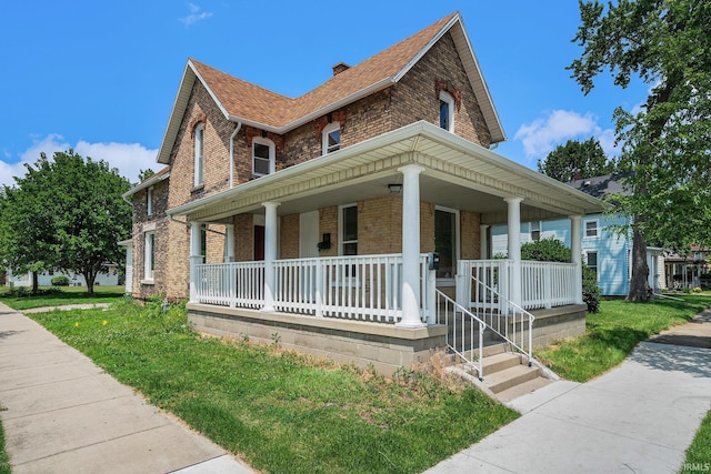 821 Thomas St, Elkhart, IN 46516 - view of front of house featuring brick siding, a porch, and roof with shingles