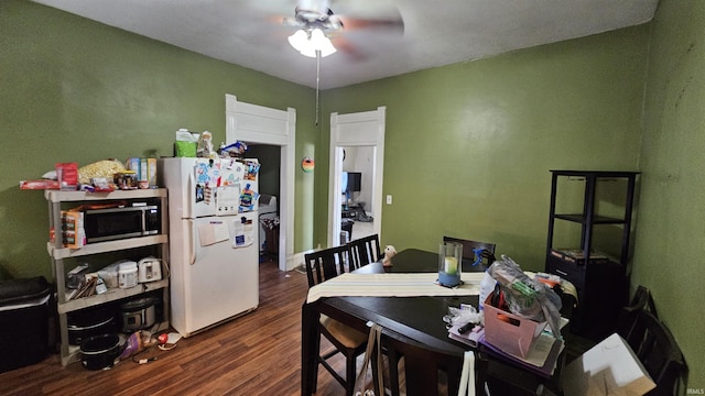 218 W Main St, Farmersburg, IN 47850 - dining area featuring a ceiling fan and dark wood-style flooring
