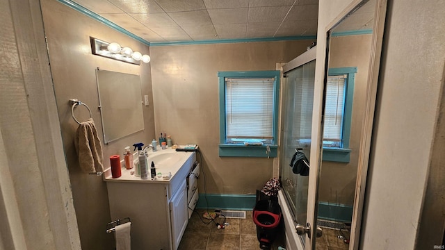 218 W Main St, Farmersburg, IN 47850 - bathroom featuring vanity, tile patterned flooring, and ornamental molding