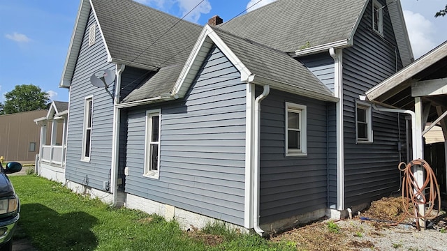 218 W Main St, Farmersburg, IN 47850 - view of side of home featuring a chimney and roof with shingles