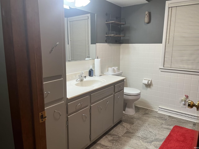 840 Giesler Rd, Jasper, IN 47546 - bathroom with tile walls, vanity, and a wainscoted wall