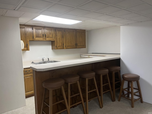 840 Giesler Rd, Jasper, IN 47546 - kitchen featuring a kitchen breakfast bar, light countertops, and brown cabinetry