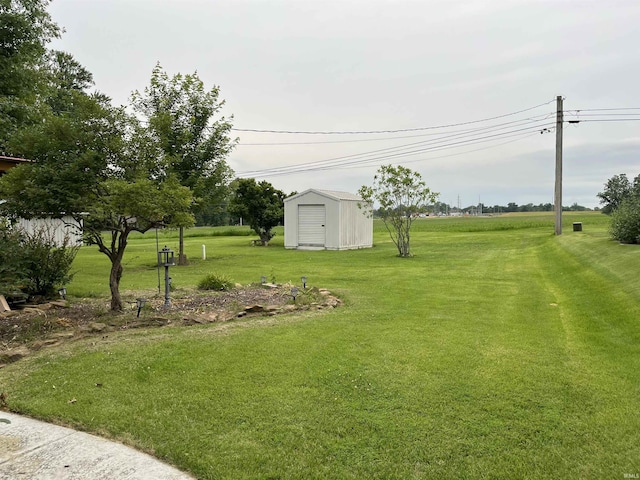 840 Giesler Rd, Jasper, IN 47546 - view of grassy yard with a storage shed