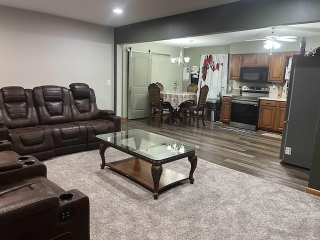 840 Giesler Rd, Jasper, IN 47546 - living area featuring dark wood-style floors, ceiling fan, recessed lighting, and a chandelier