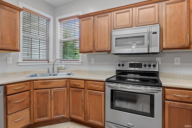 233 Sinclair Dr, West Lafayette, IN 47906 - kitchen with appliances with stainless steel finishes, brown cabinets, and light countertops