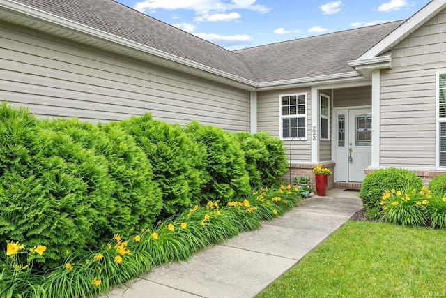 233 Sinclair Dr, West Lafayette, IN 47906 - entrance to property featuring a shingled roof and brick siding