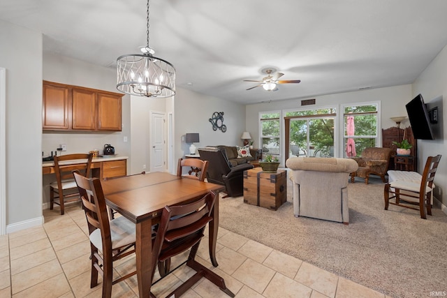 233 Sinclair Dr, West Lafayette, IN 47906 - dining space with light tile patterned flooring, ceiling fan, and a chandelier