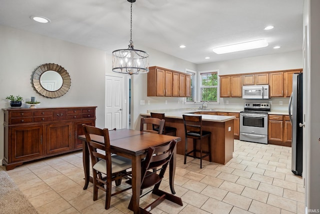 233 Sinclair Dr, West Lafayette, IN 47906 - dining area with light tile patterned floors, a chandelier, and recessed lighting