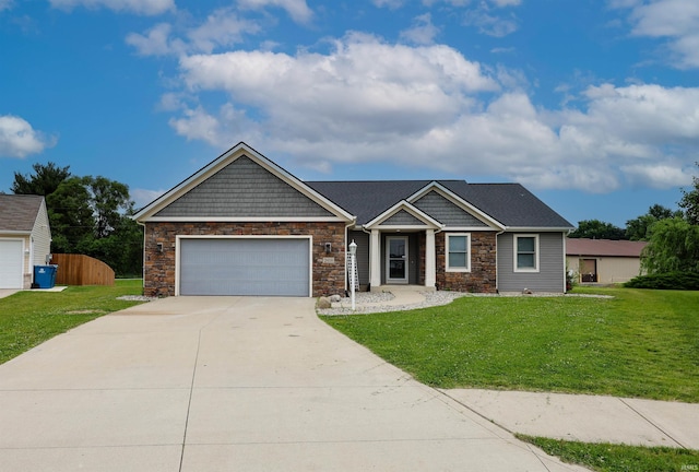 2410 Trillium Cv, Huntertown, IN 46748 - craftsman inspired home with stone siding, an attached garage, and driveway
