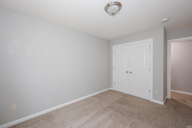 2410 Trillium Cv, Huntertown, IN 46748 - unfurnished bedroom featuring carpet flooring and a closet