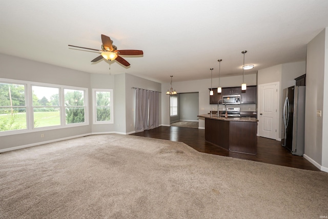 2410 Trillium Cv, Huntertown, IN 46748 - kitchen with appliances with stainless steel finishes, open floor plan, dark colored carpet, and ceiling fan