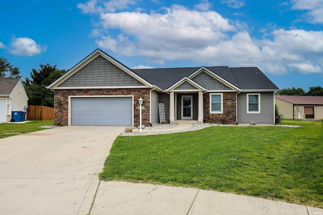 2410 Trillium Cv, Huntertown, IN 46748 - craftsman inspired home featuring stone siding, a garage, and concrete driveway