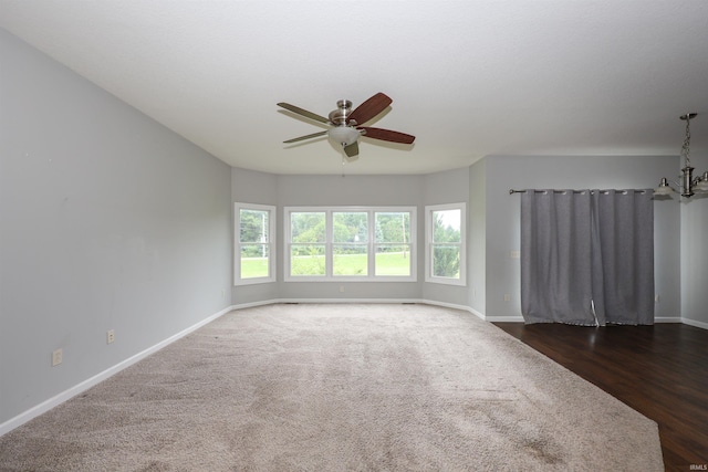 2410 Trillium Cv, Huntertown, IN 46748 - empty room with a ceiling fan and dark colored carpet