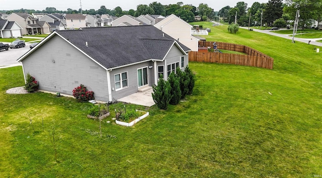 2410 Trillium Cv, Huntertown, IN 46748 - view of home's exterior featuring roof with shingles, a residential view, and a patio area