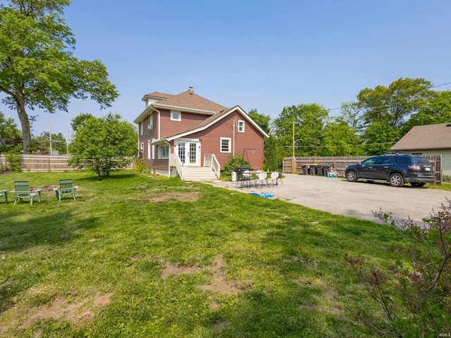 3020 Parnell Ave, Fort Wayne, IN 46805 - rear view of house featuring a patio and a chimney