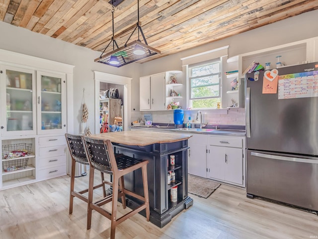 3020 Parnell Ave, Fort Wayne, IN 46805 - kitchen featuring freestanding refrigerator, open shelves, wood ceiling, white cabinets, and light wood-style flooring