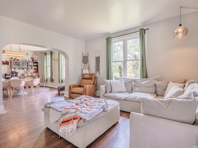 3020 Parnell Ave, Fort Wayne, IN 46805 - living room featuring arched walkways, wood finished floors, baseboard heating, and a chandelier