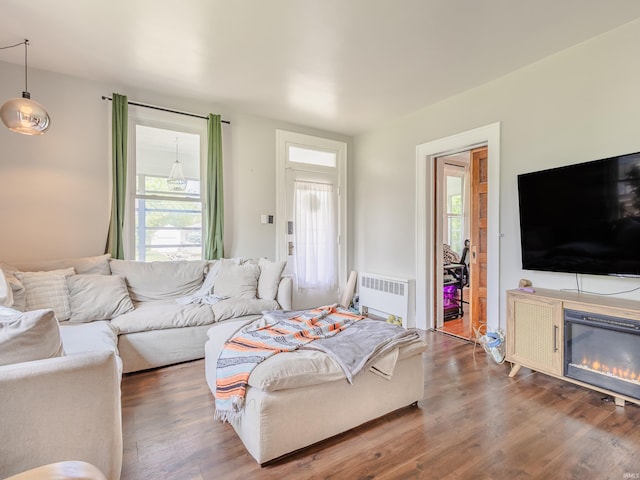 3020 Parnell Ave, Fort Wayne, IN 46805 - living area featuring radiator heating unit, plenty of natural light, and wood finished floors