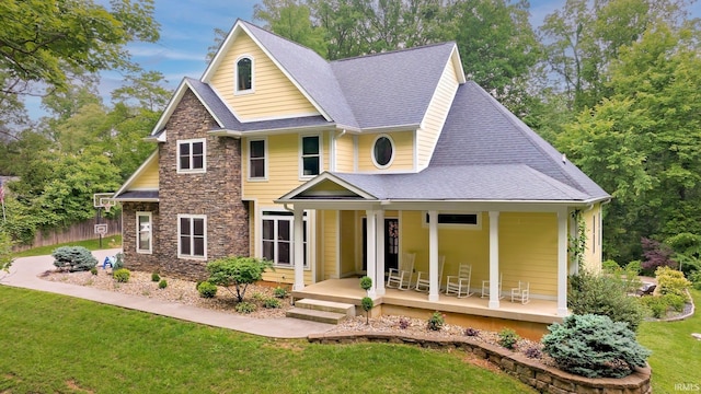 5007 W Michael Ln, Bloomington, IN 47404 - view of front of property with a porch, stone siding, and a shingled roof