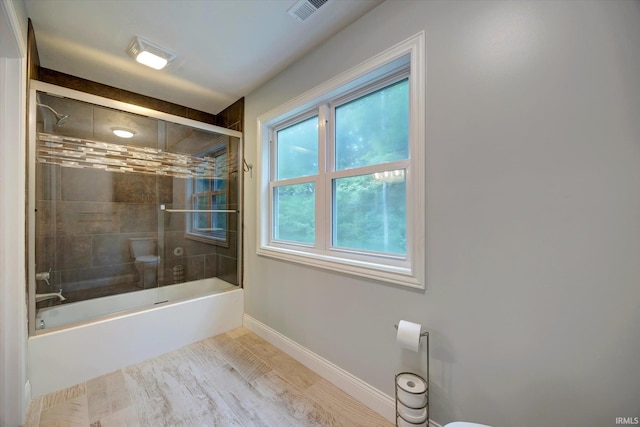 5007 W Michael Ln, Bloomington, IN 47404 - full bathroom with baseboards and combined bath / shower with glass door