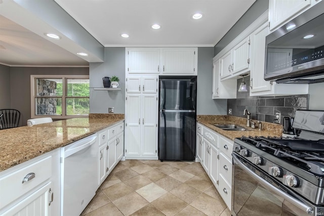 906 N Townline Rd, Lagrange, IN 46761 - kitchen with stainless steel appliances, ornamental molding, white cabinetry, light stone countertops, and recessed lighting