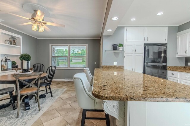 906 N Townline Rd, Lagrange, IN 46761 - kitchen with open shelves, crown molding, white cabinetry, a peninsula, and light tile patterned flooring