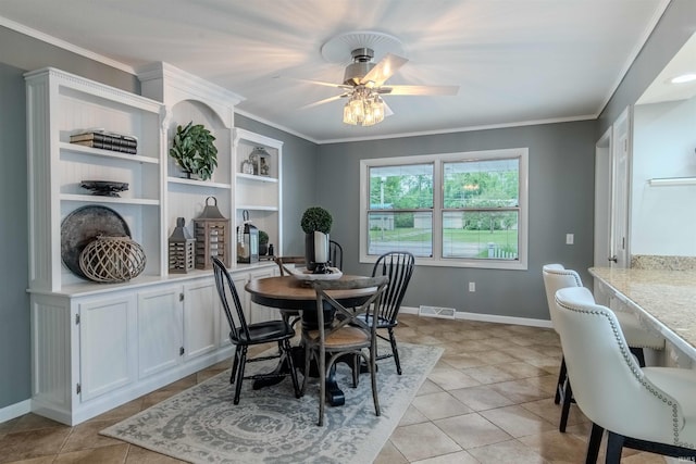 906 N Townline Rd, Lagrange, IN 46761 - dining space featuring ceiling fan, light tile patterned floors, and crown molding